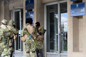 Helluntailaisia joukkohaudassa Ukrainassa