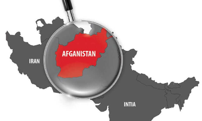 Kartta, jonka yllä suurennuslasi. Suurennuslasissa näkyy Afganistan.