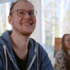 a_man_and_a_woman_are_smiling_in_classroom_photo_Kylvaja