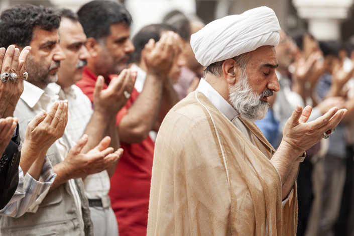 men_praying_holding_hands_up_muslims_photo_IMB