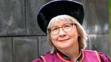 a_woman_looking_at_camera_smiling_photo_Saija_Tiilikainen